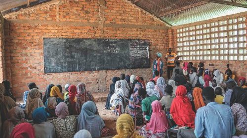 Children listen during a summer school class at Ngueredomo Primary School in Birao on August 12, ... Children listen during a summer school class at Ngueredomo Primary School in Birao on August 12, ...