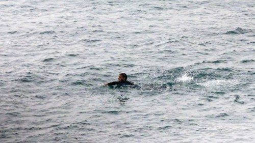 epa11565214 A migrant swims to enter Ceuta, Spanish enclave in the North of Africa, 26 August 2024. ...