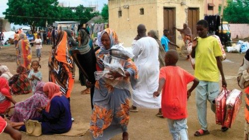 Sudanese, displaced from the town of Sinjah, receive humanitarian aid at their makeshift camp in the ... Sudanese, displaced from the town of Sinjah, receive humanitarian aid at their makeshift camp in the ...