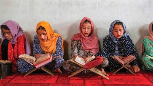 TOPSHOT - In this photo taken on July 24, 2024, Afghan girls read the holy Quran at a madrassa ... TOPSHOT - In this photo taken on July 24, 2024, Afghan girls read the holy Quran at a madrassa ...
