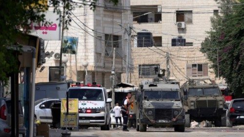 epa11568283 Israeli army vehicles are parked outside a hospital during a military operation in the ... epa11568283 Israeli army vehicles are parked outside a hospital during a military operation in the ...