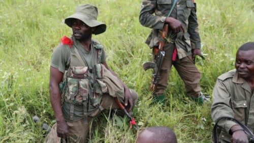 Democratic Republic of Congo soldiers rest next to a road after Allied Democratic Forces rebels ... Democratic Republic of Congo soldiers rest next to a road after Allied Democratic Forces rebels ...