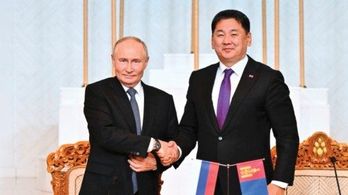 In this pool photograph distributed by the Russian state agency Sputnik, Russia's President Vladimir ... In this pool photograph distributed by the Russian state agency Sputnik, Russia's President Vladimir ...