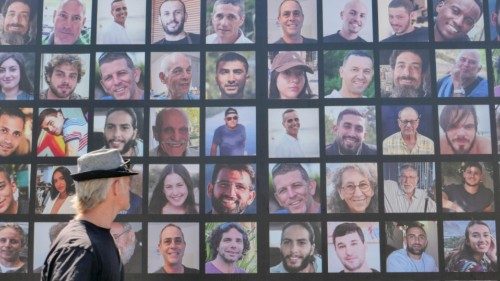 epa11581357 A man looks at a billboard showing pictures of Israeli hostages held by Hamas in Gaza in ... epa11581357 A man looks at a billboard showing pictures of Israeli hostages held by Hamas in Gaza in ...