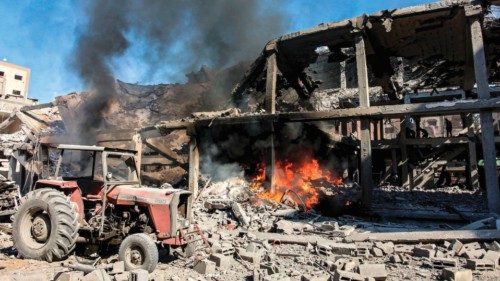 Flames are ablaze in a building that was hit by Israeli bombardment in the Sheikh Radwan ... Flames are ablaze in a building that was hit by Israeli bombardment in the Sheikh Radwan ...