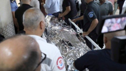 epa11590021 Palestinian healthcare workers push a stretcher with the body of a US citizen at Rafidia ... epa11590021 Palestinian healthcare workers push a stretcher with the body of a US citizen at Rafidia ...