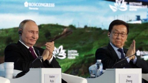 In this pool photograph distributed by the Russian state agency Sputnik, Russia's President Vladimir ... In this pool photograph distributed by the Russian state agency Sputnik, Russia's President Vladimir ...
