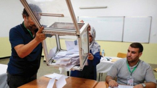 Election officials count the ballots at a polling station during the presidential election, in ... Election officials count the ballots at a polling station during the presidential election, in ...