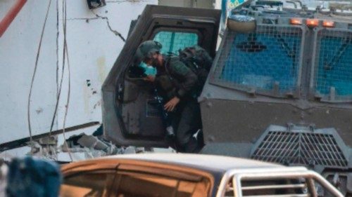TOPSHOT - Israeli army soldiers keep position during a raid in Tulkarem camp on September 10, 2024, ... TOPSHOT - Israeli army soldiers keep position during a raid in Tulkarem camp on September 10, 2024, ...
