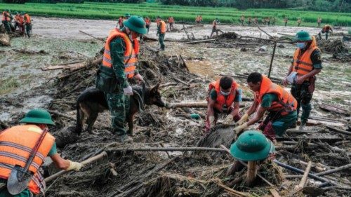TOPSHOT - Rescue officials sift through debris at the site of a landslide in the remote mountainous ... TOPSHOT - Rescue officials sift through debris at the site of a landslide in the remote mountainous ...