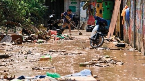 A resident cleans up on a street after flood waters receded in Hanoi on September 13, 2024. Typhoon ... A resident cleans up on a street after flood waters receded in Hanoi on September 13, 2024. Typhoon ...