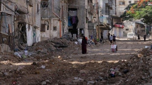epa11602187 Palestinians inspect the damage following an Israeli operation at Tulkarem refugee camp, ...