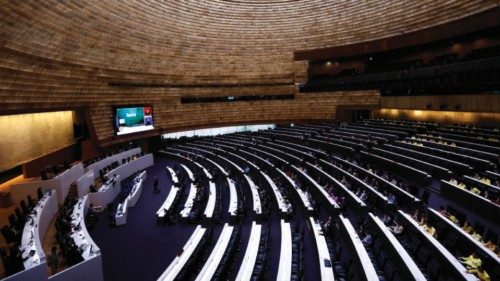 epa11599480 A general view shows members of the House of Representatives attending the government's ...