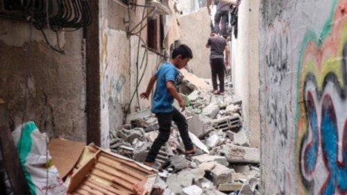 A Palestinian boy walks amid debris following Israeli bombardment in Nuseirat in the central Gaza ... A Palestinian boy walks amid debris following Israeli bombardment in Nuseirat in the central Gaza ...