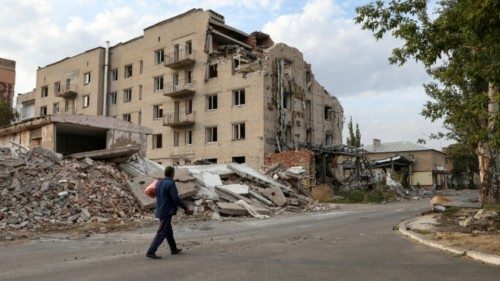 A man walks past a building damaged by a Russian military strike in seen in the town of Pokrovsk, ... A man walks past a building damaged by a Russian military strike in seen in the town of Pokrovsk, ...