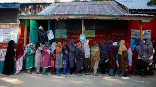 Kashmiri women queue to vote at a polling station, during the first phase of assembly election, in ... Kashmiri women queue to vote at a polling station, during the first phase of assembly election, in ...