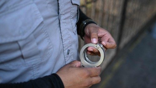 A prison guard holds handcuffs at La Esperanza prison in San Salvador on August 29, 2024. Bukele's ... A prison guard holds handcuffs at La Esperanza prison in San Salvador on August 29, 2024. Bukele's ...