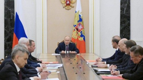 In this pool photograph distributed by the Russian state agency Sputnik, Russia's President Vladimir ... In this pool photograph distributed by the Russian state agency Sputnik, Russia's President Vladimir ...