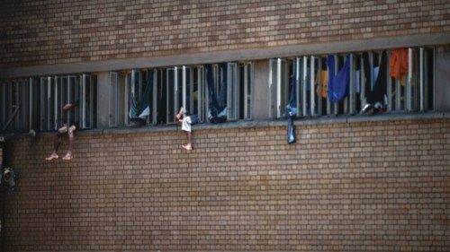 Inmates sit on the window of their cell in the Kgosi Mampuru II Prison where Oscar Pistorius spent ... Inmates sit on the window of their cell in the Kgosi Mampuru II Prison where Oscar Pistorius spent ...