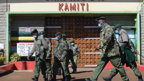 Kenya prison warders walk past the entrance of the Kamiti Maximum Security Prison in Nairobi, on ... Kenya prison warders walk past the entrance of the Kamiti Maximum Security Prison in Nairobi, on ...