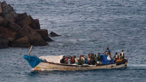 (FILES) A 'cayuco' boat with 57 migrants onboard arrives at La Restinga port on the Canary island of ... (FILES) A 'cayuco' boat with 57 migrants onboard arrives at La Restinga port on the Canary island of ...
