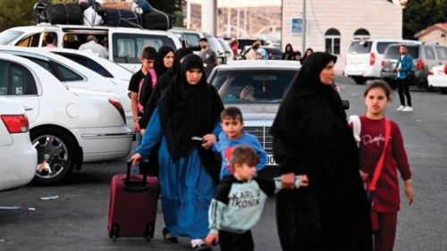 People fleeing from Lebanon arrive on the Syrian side of the border with Lebanon in Jdeidat Yabus in ... People fleeing from Lebanon arrive on the Syrian side of the border with Lebanon in Jdeidat Yabus in ...