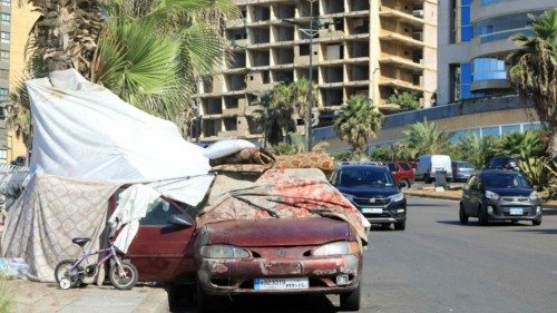 A car is used as part of a temporary shelter installed by people who fled Israeli bombing and took ... A car is used as part of a temporary shelter installed by people who fled Israeli bombing and took ...