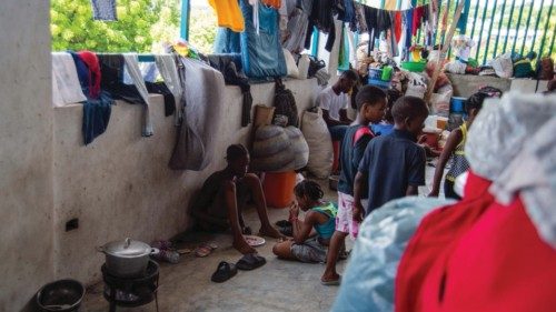 Children gather in a displacement camp at the Lycée Marie Jeanne school in Port-au-Prince, Haiti on ... Children gather in a displacement camp at the Lycée Marie Jeanne school in Port-au-Prince, Haiti on ...