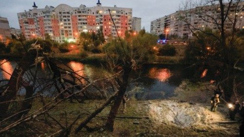 epa11649705 Ukrainian policemen and experts work at the site of a shelling of a recreation area near ...