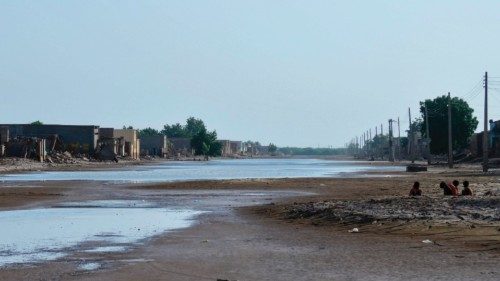 Sudanese children sit by a flooded street in Tokar in the Read Sea State following recent heavy ... Sudanese children sit by a flooded street in Tokar in the Read Sea State following recent heavy ...