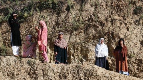 Kashmiri women wait outside the polling station after casting their vote at a polling station, ... Kashmiri women wait outside the polling station after casting their vote at a polling station, ...