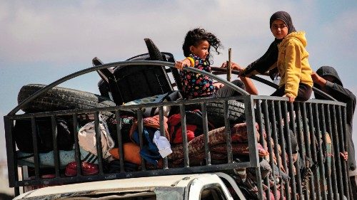 Children ride with furniture in the back of a truck as displaced people arrive in Khan Yunis after ... Children ride with furniture in the back of a truck as displaced people arrive in Khan Yunis after ...