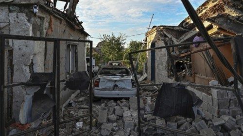 A view shows residential buildings and cars damaged by a Russian air strike, amid Russia's attack on ... A view shows residential buildings and cars damaged by a Russian air strike, amid Russia's attack on ...
