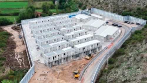 (FILES) This aerial photo shows the site of a recently build Italian-run migrant centre at the port ... (FILES) This aerial photo shows the site of a recently build Italian-run migrant centre at the port ...