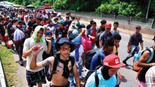 Migrants of different nationalities walk towards the United States on a highway in Tapachula, ... Migrants of different nationalities walk towards the United States on a highway in Tapachula, ...