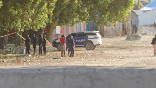 Somali police secure the scene of an explosion in a restaurant often patronised by police officers, ...