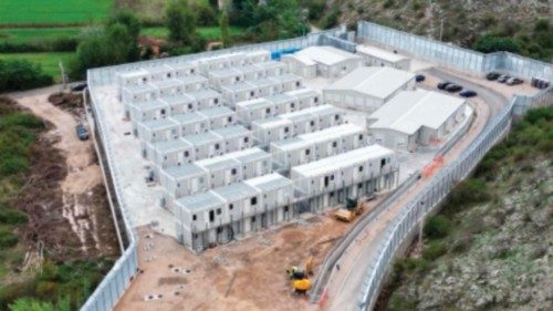 (FILES) This aerial photo shows the site of a recently build Italian-run migrant centre at the port ...