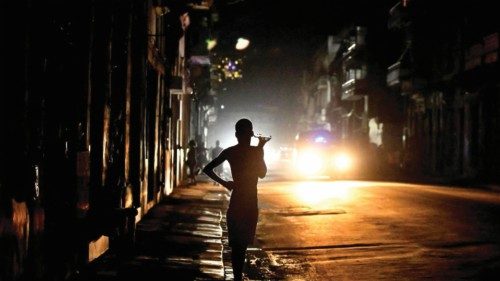 People stand in the street at night as Cuba is hit by an island-wide blackout, in Havana, Cuba, ... People stand in the street at night as Cuba is hit by an island-wide blackout, in Havana, Cuba, ...