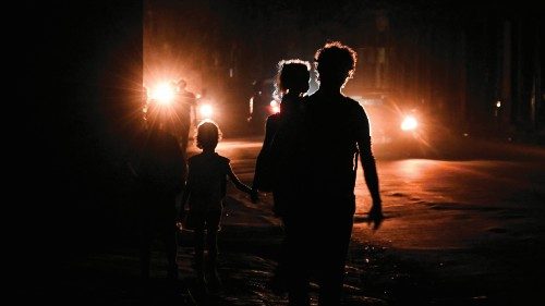 Cubans walk on a street during the third night of a nationwide blackout in Havana October 19, 2024. ... Cubans walk on a street during the third night of a nationwide blackout in Havana October 19, 2024. ...