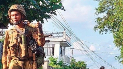 Members of the Ta'ang National Liberation Army (TNLA) walk along a road in Hsipaw on October 15, ... Members of the Ta'ang National Liberation Army (TNLA) walk along a road in Hsipaw on October 15, ...