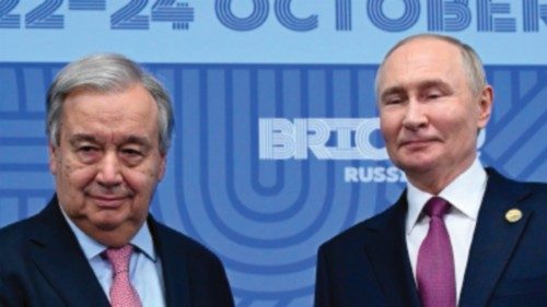 epa11681511 Russian President Vladimir Putin (R) greets United Nations (UN) Secretary General ...