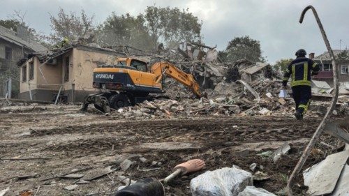 Rescuers work at a site of an apartment building destroyed by a Russian missile strike, amid ... Rescuers work at a site of an apartment building destroyed by a Russian missile strike, amid ...