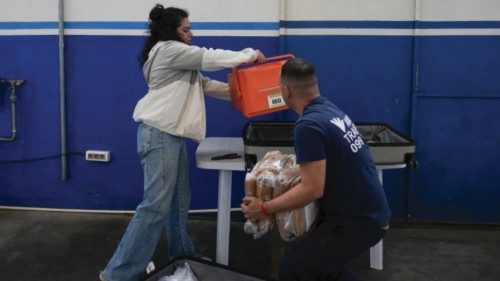 Workers of the electoral court prepare to distribute voting materials for the upcoming general ... Workers of the electoral court prepare to distribute voting materials for the upcoming general ...