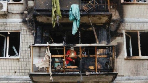 epaselect epa11691953 A woman checks the damage in a flat at the site of an overnight drone attack ... epaselect epa11691953 A woman checks the damage in a flat at the site of an overnight drone attack ...