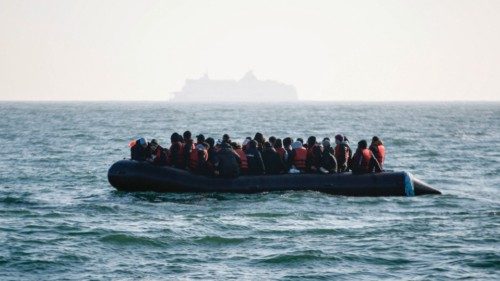 (FILES) Migrants wait for help from the Abeille Languedoc ship after their boat's generator broke ... (FILES) Migrants wait for help from the Abeille Languedoc ship after their boat's generator broke ...
