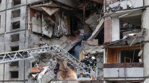 Rescuers work at the site of an apartment building which was hit by a Russian air strike in Kharkiv, ... Rescuers work at the site of an apartment building which was hit by a Russian air strike in Kharkiv, ...