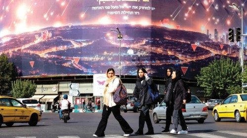 Women walk past an anti-Israel billboard covering the facade of a building in Tehran on October 26, ... Women walk past an anti-Israel billboard covering the facade of a building in Tehran on October 26, ...