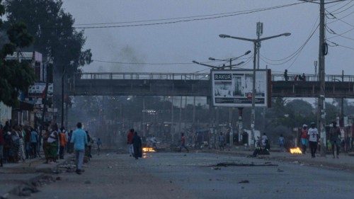 Tires burning are seen burning along a road in the Xiquelene neighbourhood of Mozambique's capital ...