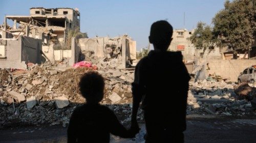 TOPSHOT - Children stare at the destruction following an Israeli strike in the Nuseirat refugee camp ... TOPSHOT - Children stare at the destruction following an Israeli strike in the Nuseirat refugee camp ...
