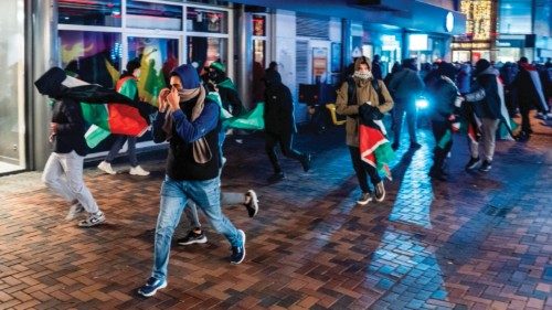 epa11708049 Demonstrators run with Palestinian flags ahead of the UEFA Europa League match between ... epa11708049 Demonstrators run with Palestinian flags ahead of the UEFA Europa League match between ...